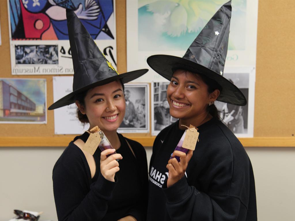 HPU school of education students with their potions created in the classroom